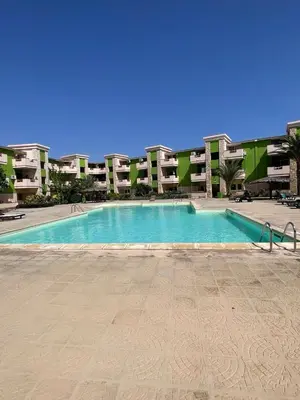 a large swimming pool in front of a building at Djadsal Moradias - Near the ocean in Santa Maria