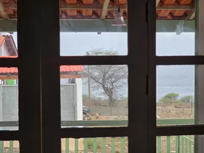 a view of the ocean from a window at Bougainvillea Villa in Cidade Velha