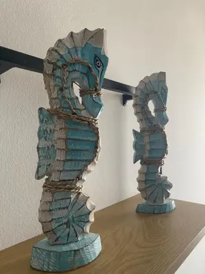 two glass sculptures sitting on top of a table at Tropical Anzso in Santa Maria