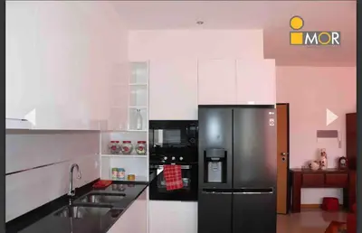 a kitchen with a black refrigerator and a sink at 3-bedroom Apartment Praia Santiago in Praia