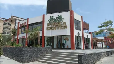 a building with a sign on the front of it at 3-bedroom Apartment Praia Santiago in Praia
