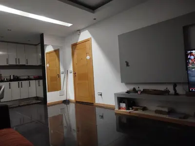 a kitchen with two wooden doors in a room at Sofia Évora Spínola in Cova Figueira