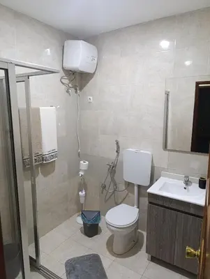 a bathroom with a toilet and a sink at Sossego & Conforto in Espargos