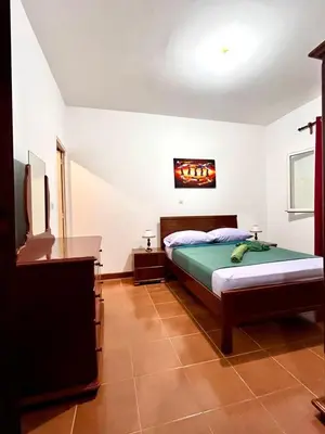 a bedroom with a bed and a television in it at Casa BB&Djassi - Apartment T1 in Ponta do Sol