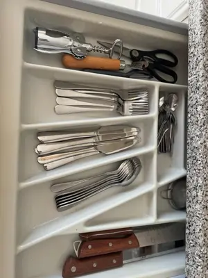 a drawer full of utensils in a refrigerator at Murdeira V152 Duplex by RPG Group in Beirona