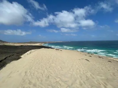 a sandy beach with the ocean in the background at Mindelo Bay Apartment in Mindelo