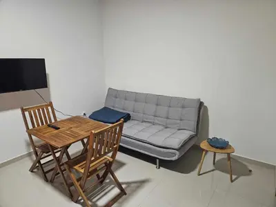 a living room with a couch and a table at Sheila Apartment in Espargos