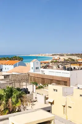 a view of a city with the ocean in the background at 1 Bedroom - 150m from the Beach - Pool in Santa Maria