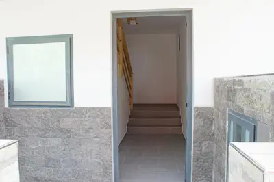 a door leading to a hallway with a stair case at Sal Casa VILLAGE in Santa Maria