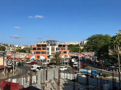 a view of a city with a parking lot at Central 1-Bedroom Apartment near Sucupira Market in Praia