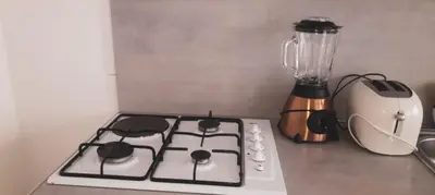 a stove top oven with a blender on a counter at Tarrafal snuggle in Tarrafal