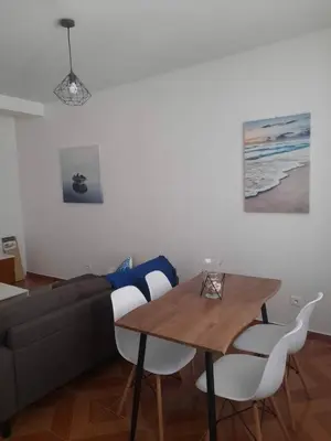 a living room with a table and a couch at Tarrafal snuggle in Tarrafal