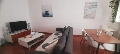 a living room with a couch and a table at Tarrafal snuggle in Tarrafal