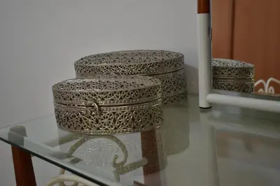 three stools sitting on a glass table at Casa Berta - Downtown Apartment in Praia