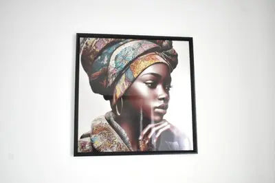 a portrait of a woman wearing a turban at Casa Berta - Downtown Apartment in Praia