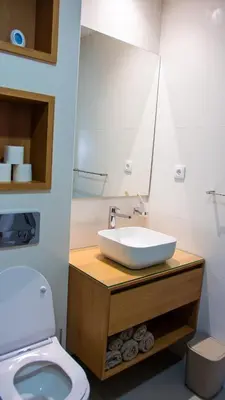 a bathroom with a sink and a toilet at Domus Lima in Mindelo