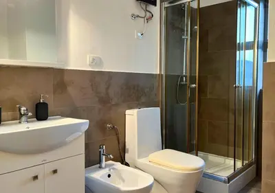 a bathroom with a toilet and a sink and a shower at MonteCara View T1 in Mindelo