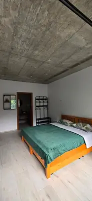 a bedroom with a large bed in a room at The Pink Banana in Paul
