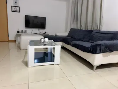 a living room with a couch and a table at vitoria in Praia