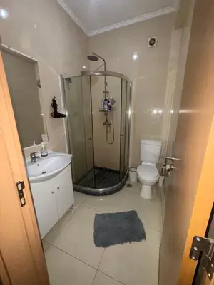 a bathroom with a shower and a toilet and a sink at vitoria in Praia