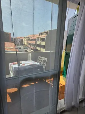 a view of a balcony with a bed and a window at Soul of Sal in Santa Maria