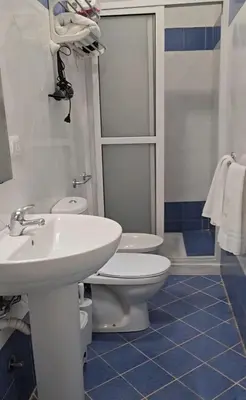 a bathroom with a sink and a toilet and a shower at Soul of Sal in Santa Maria