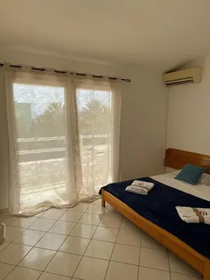a bedroom with a bed and a large window at Murdeira V159D Duplex by RPG Group in Beirona
