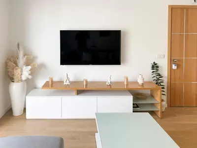 a living room with a tv on a white wall at Cozy 1-bdr apt, Cidadela - LCGR in Praia