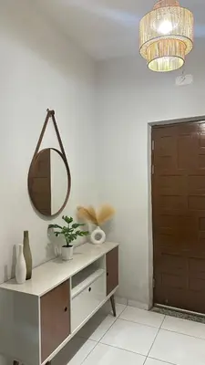 a mirror on top of a dresser in a room at T2 Vacation in Mindelo in Mindelo