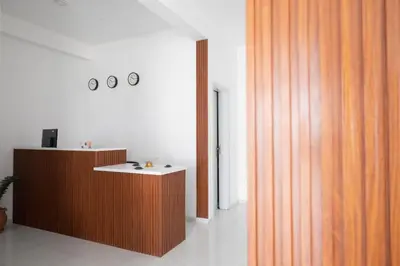 a room with a counter and a wooden wall at Apart'hotel Assomada in Assomada