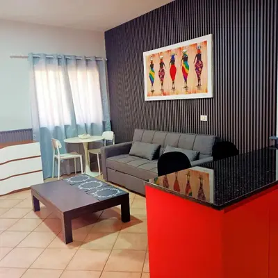 a living room with a couch and a table at Ca' Estrella Santa Maria Sal in Santa Maria
