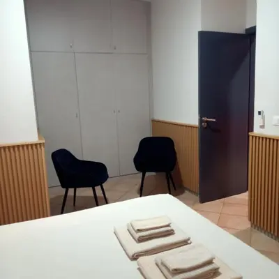 a room with two chairs and a table with towels at Ca' Estrella Santa Maria Sal in Santa Maria