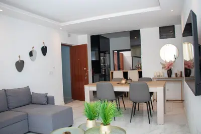 a living room with a couch and a table at Fresh One Apartment in Praia