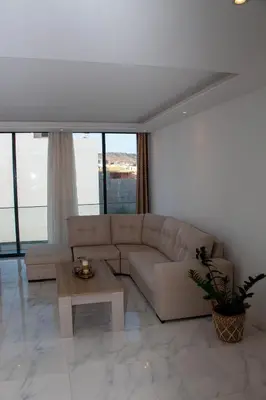 a living room with a couch and a coffee table at Fresh One Too Apartment in Praia