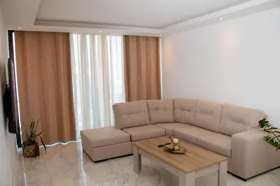 a living room with a couch and a coffee table at Fresh One Too Apartment in Praia