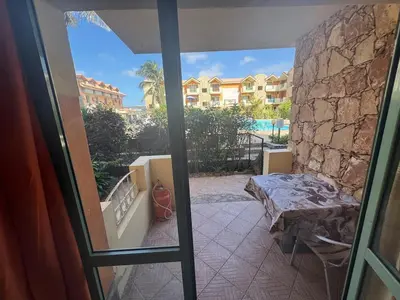 a room with a view of a balcony with a bed at Holiday Properties Djadsal Pirata - Wi-fi in Santa Maria