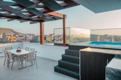 a house with a swimming pool and a table and chairs at Yes Rooftop, Private Pool & Sea View, Cidadela in Praia