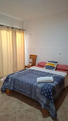 a bedroom with a large bed with two towels on it at Star House Murdeira, Sal Island, Cape Verde in Beirona
