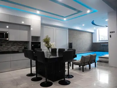 a kitchen with a dining room table and chairs at Top-Level Pool in Praia