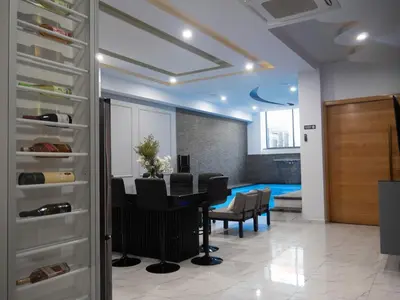 a dining room with a table and chairs in a room at Top-Level Pool in Praia