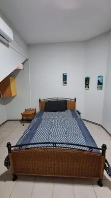 a bedroom with a large bed in a room at Kaza Manata in Praia