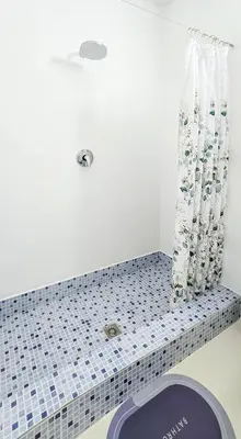 a bathroom with a blue and white tiled counter top at Casa Albacora in Sal Rei