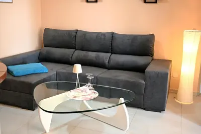 a living room with a couch and a glass table at Nature Breeze in Sal Rei