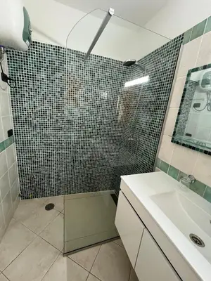 a bathroom with a shower and a sink at Rosa dei venti 3 in Santa Maria