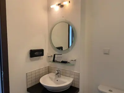 a bathroom with a sink and a mirror at Casa de Cabo Verde in Santa Maria