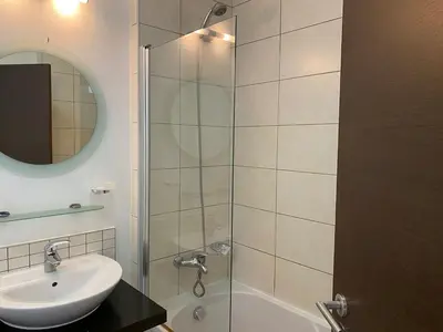 a bathroom with a sink and a glass shower at Casa de Cabo Verde in Santa Maria