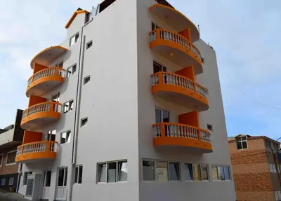 a building with orange balconies on the side of it at Hotel Miranda & Miranda in Ponta do Sol