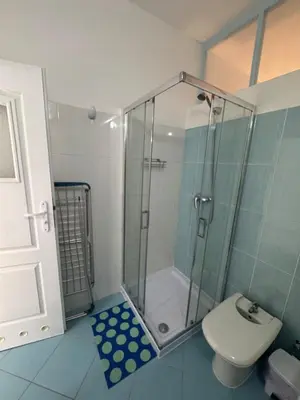 a bathroom with a shower and a toilet at Holiday Properties Ocean Breeze in Santa Maria