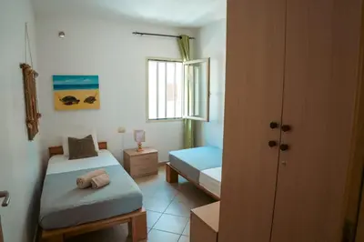 a bedroom with two beds and a window at Orange by No Stress ACWifi in Santa Maria