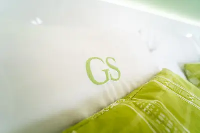 a close up of the letter g on a pair of green pants at GREEN STUDIO TARRAFAL - Ap 03 in Tarrafal